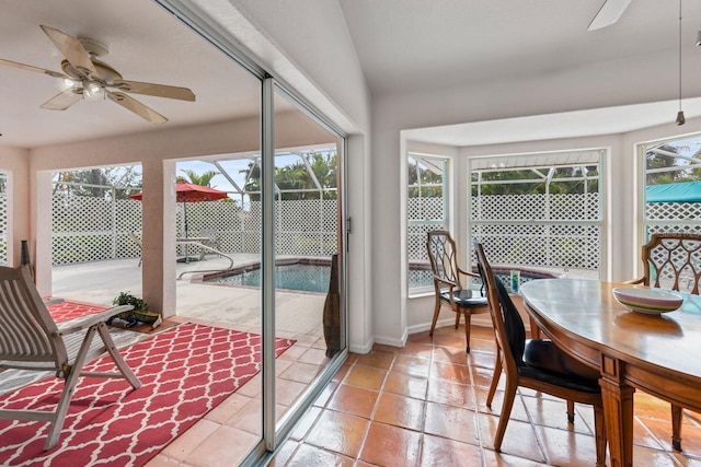 sunroom with ceiling fan and plenty of natural light