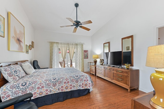 bedroom with ceiling fan, wood-type flooring, and lofted ceiling