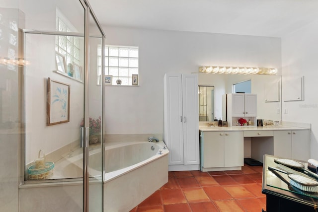 bathroom featuring tile patterned floors, separate shower and tub, and vanity