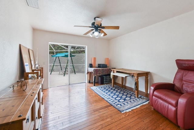 office space with ceiling fan and light hardwood / wood-style flooring