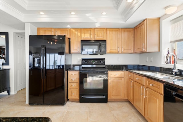 kitchen featuring a raised ceiling, black appliances, dark stone counters, ornamental molding, and sink