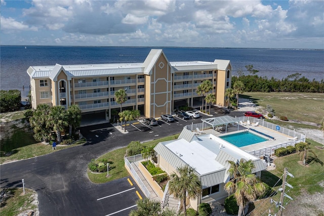 birds eye view of property with a water view