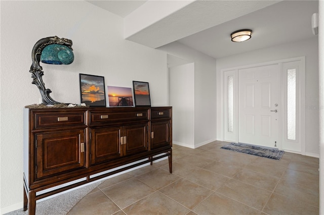 foyer featuring light tile patterned floors