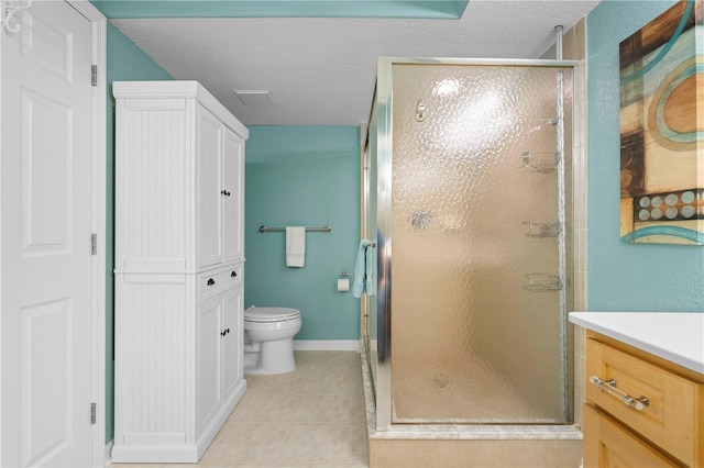 bathroom featuring a textured ceiling, tile patterned flooring, toilet, walk in shower, and vanity