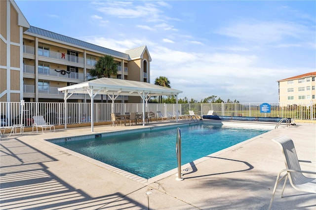 view of swimming pool with a patio