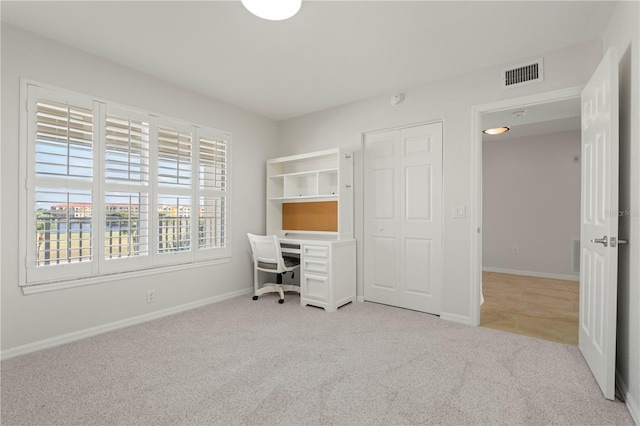 unfurnished office with light colored carpet