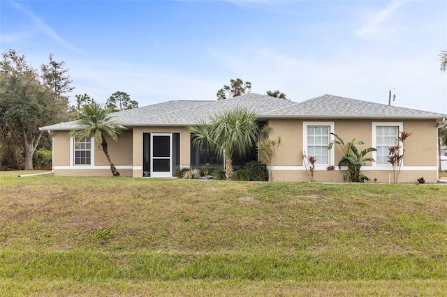 ranch-style house with a front lawn