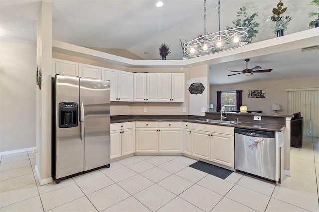 kitchen featuring stainless steel appliances, light tile patterned floors, white cabinetry, ceiling fan, and sink