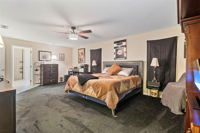 bedroom featuring ensuite bath, light carpet, and ceiling fan