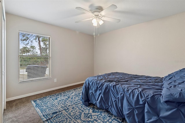 bedroom with ceiling fan and carpet flooring