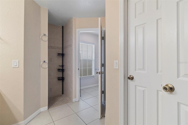 hallway with light tile patterned floors