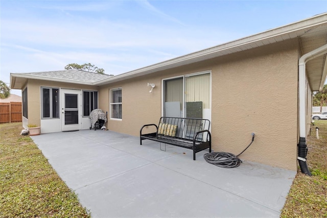 back of house with a patio