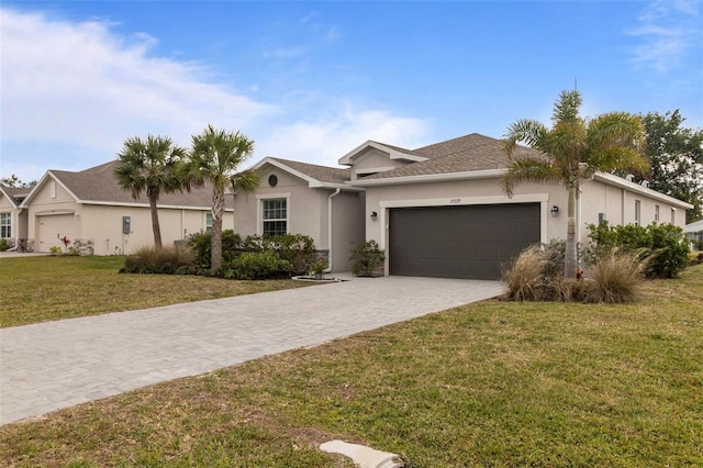 single story home featuring a front yard and a garage