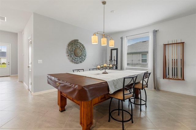 tiled dining space with billiards