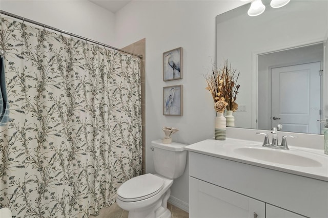 bathroom with toilet and vanity