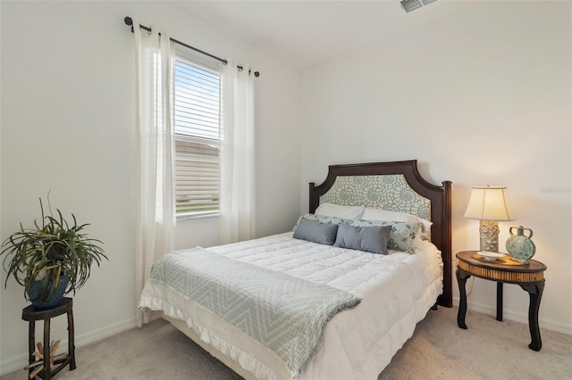 bedroom featuring light colored carpet