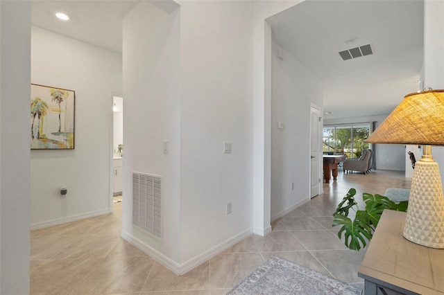 hall featuring light tile patterned floors