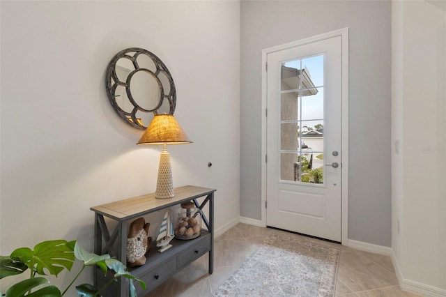 foyer featuring light tile patterned floors