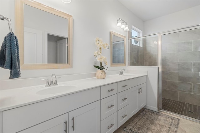 bathroom featuring walk in shower and vanity