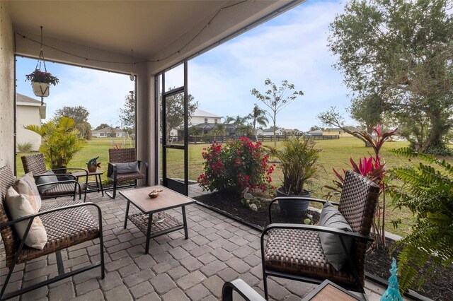 sunroom / solarium with a wealth of natural light