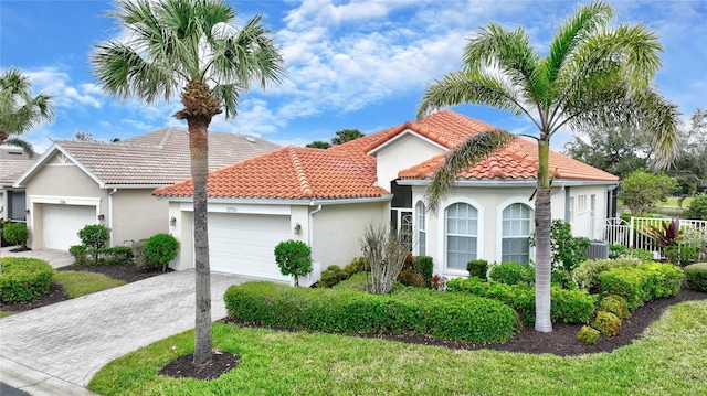 mediterranean / spanish-style home featuring a garage