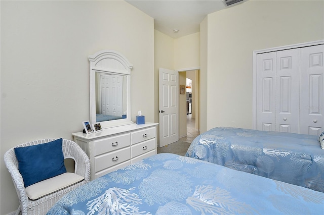 carpeted bedroom featuring a closet