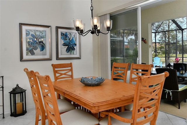 dining room featuring light tile patterned flooring and a chandelier