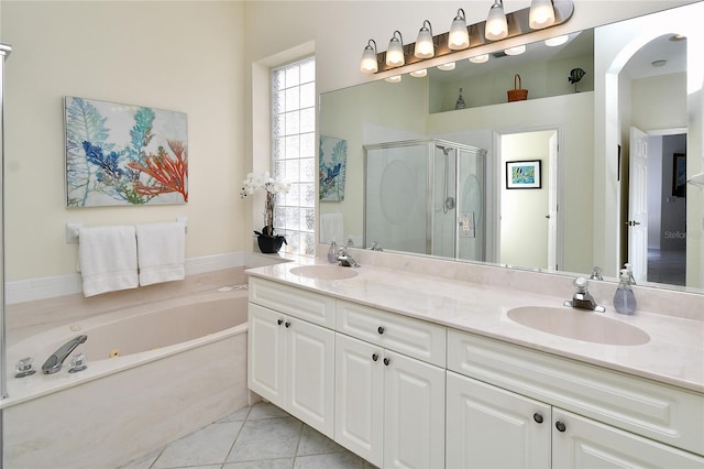 bathroom with plus walk in shower, tile patterned floors, and vanity