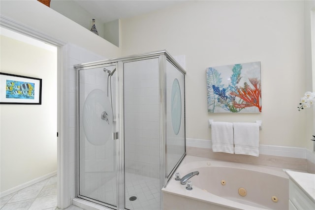 bathroom with vanity, tile patterned flooring, and shower with separate bathtub