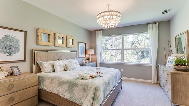 carpeted bedroom with a chandelier