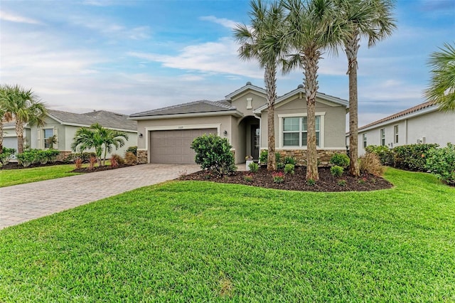 ranch-style home with a garage and a front yard