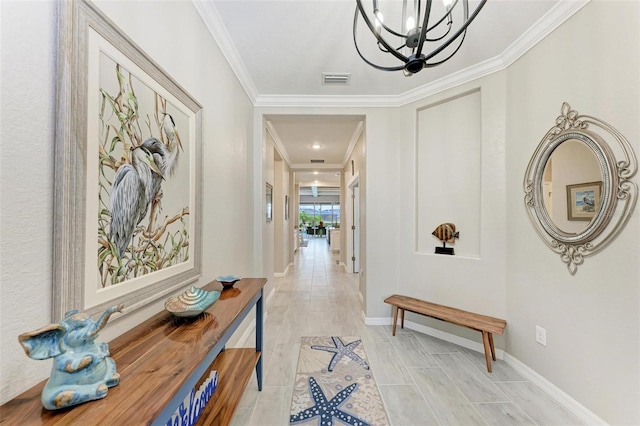 hall featuring light hardwood / wood-style floors, crown molding, and a chandelier