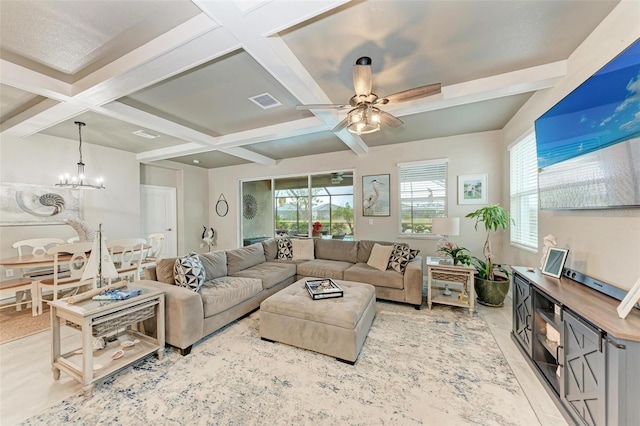 living room featuring coffered ceiling, beamed ceiling, and ceiling fan with notable chandelier