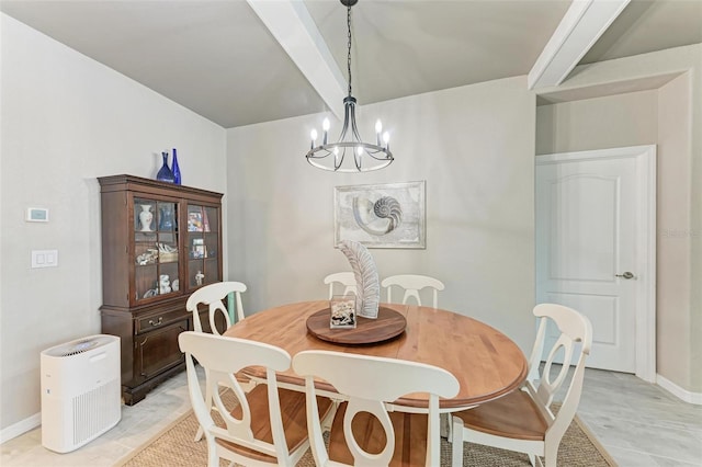 dining space featuring a chandelier and beam ceiling