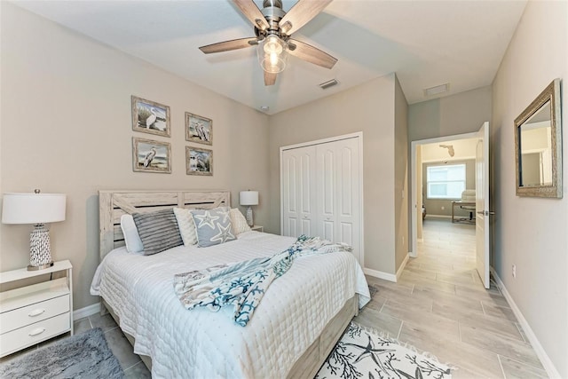 bedroom featuring ceiling fan and a closet