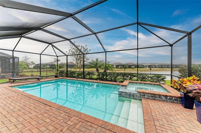 view of swimming pool with an in ground hot tub, a lanai, a water view, and a patio