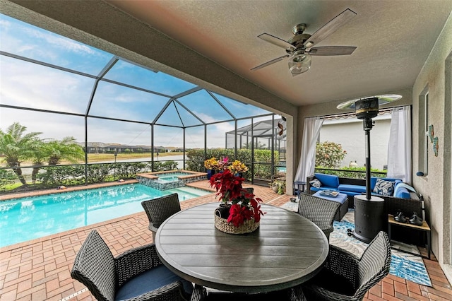 view of swimming pool with an in ground hot tub, outdoor lounge area, glass enclosure, and a patio area