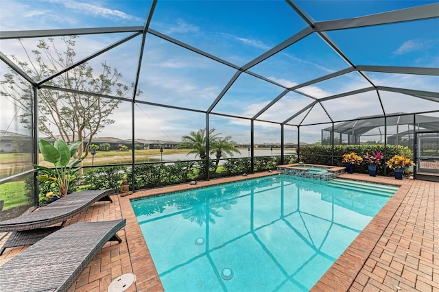 view of swimming pool featuring glass enclosure, an in ground hot tub, a water view, and a patio