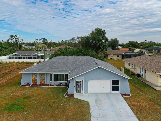 view of front of home featuring a front yard, cooling unit, and a garage