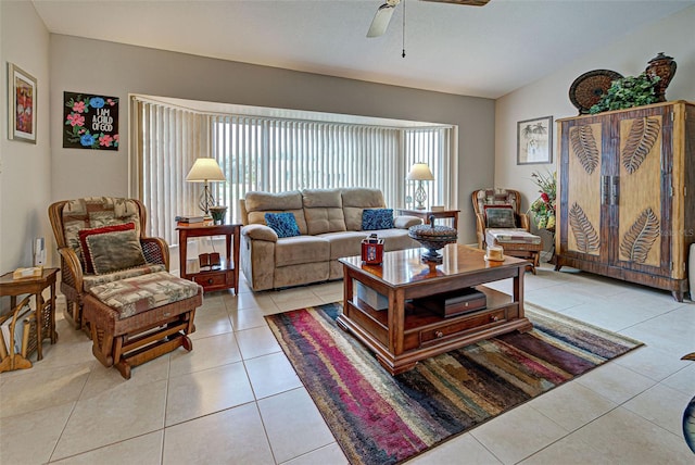 tiled living room featuring vaulted ceiling and ceiling fan