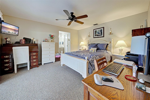 bedroom featuring ceiling fan, ensuite bath, and carpet