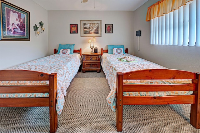 bedroom with light carpet and ceiling fan