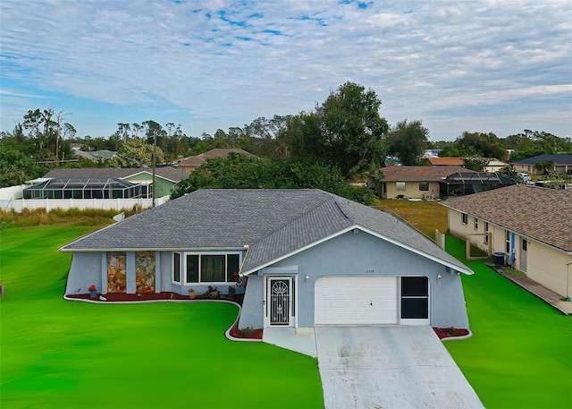 ranch-style house featuring a garage and a front yard