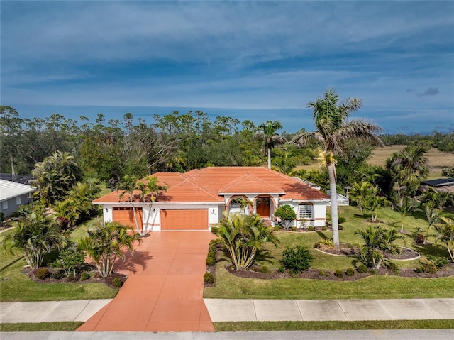 view of front facade featuring a garage and a front yard