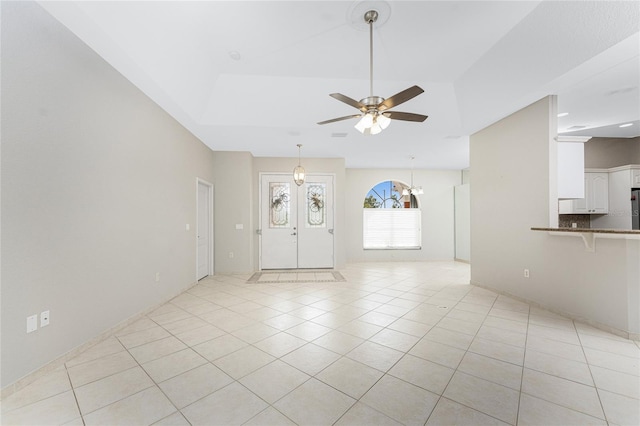 tiled entrance foyer featuring ceiling fan