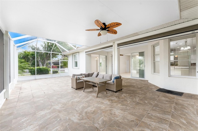 view of patio / terrace with glass enclosure, an outdoor hangout area, and ceiling fan