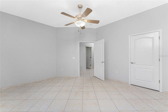 unfurnished bedroom featuring ceiling fan and light tile patterned floors