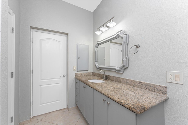 bathroom featuring tile patterned floors and vanity