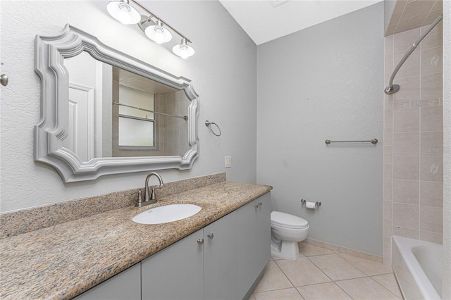 full bathroom with toilet, tile patterned flooring, tiled shower / bath, and vanity