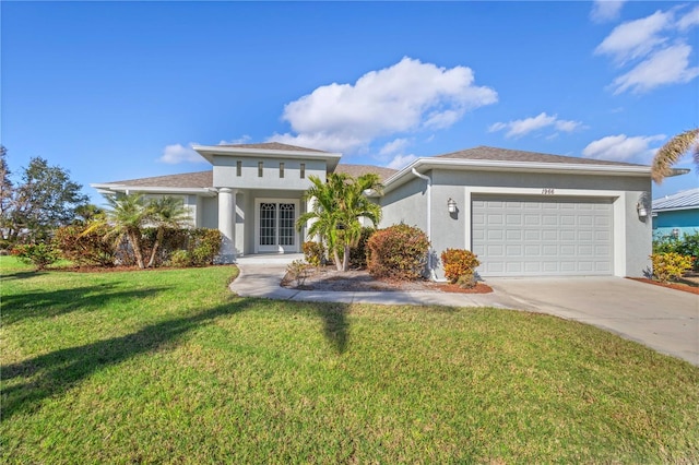 view of front of home featuring a garage and a front yard